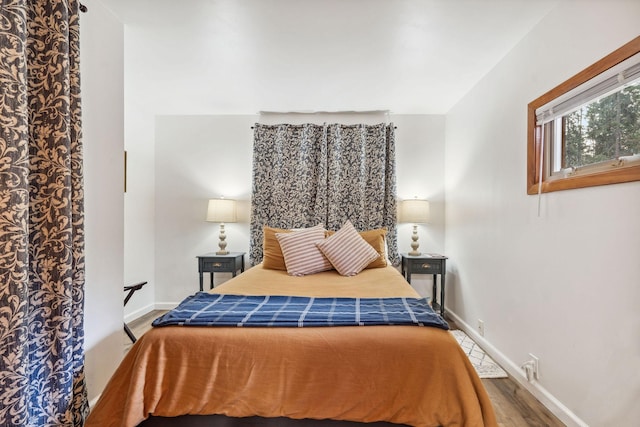 bedroom featuring hardwood / wood-style floors