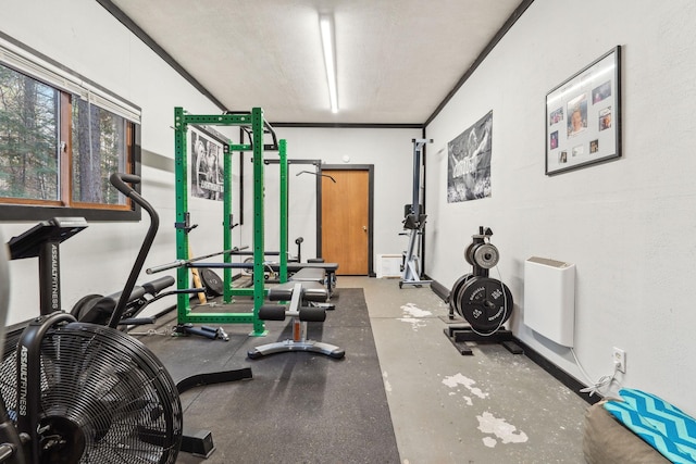 exercise area featuring a textured ceiling