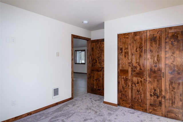 unfurnished bedroom featuring carpet