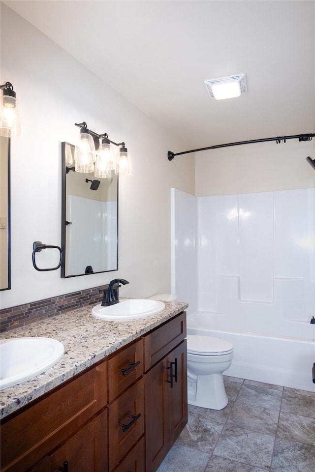 full bathroom with bathing tub / shower combination, vanity, and toilet