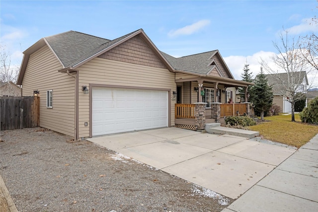 view of front of home featuring covered porch and a garage