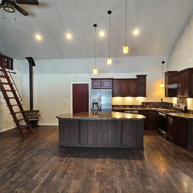 kitchen featuring stainless steel appliances, a center island, decorative backsplash, dark brown cabinetry, and pendant lighting