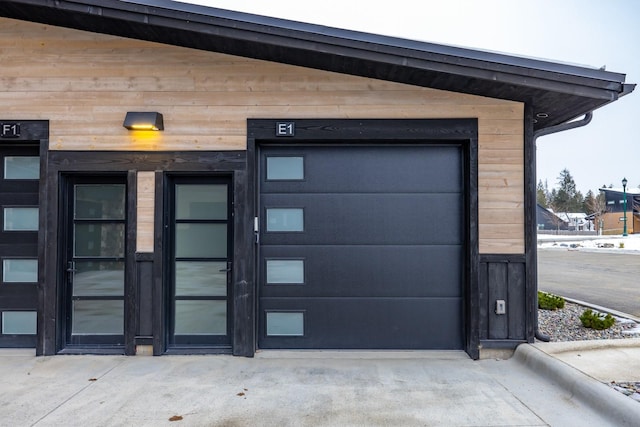 view of exterior entry featuring a garage