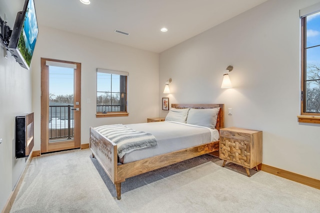 carpeted bedroom featuring access to outside