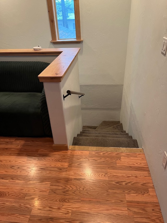 staircase featuring hardwood / wood-style flooring