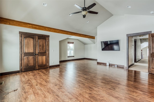 additional living space with visible vents, baseboards, a ceiling fan, lofted ceiling, and light wood-style flooring