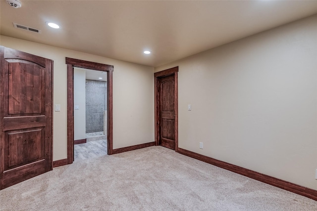 unfurnished bedroom with light carpet, baseboards, visible vents, and recessed lighting