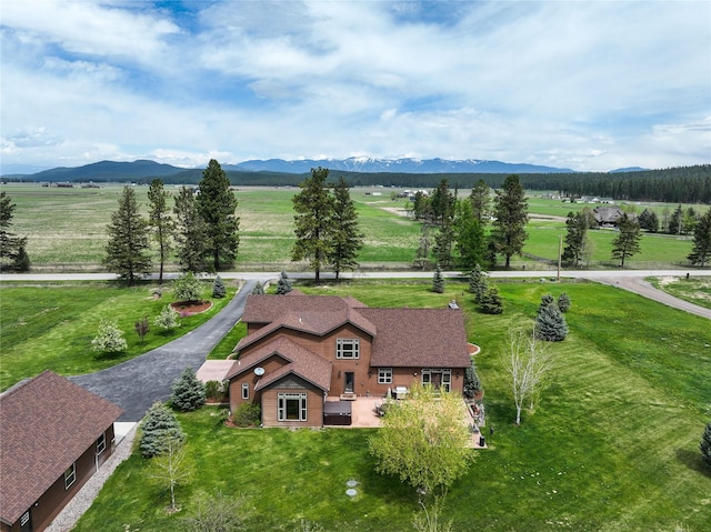 drone / aerial view with a mountain view and a rural view