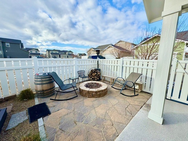 view of patio / terrace with a fire pit