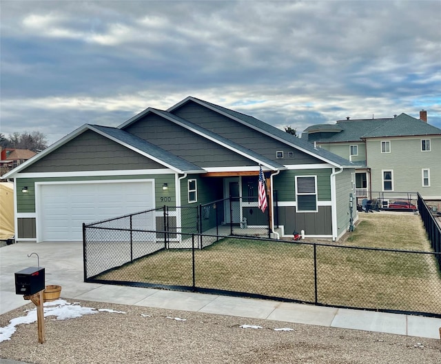 view of front of home with a garage and a front yard