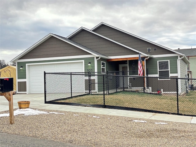 view of front of property with a garage and a front lawn