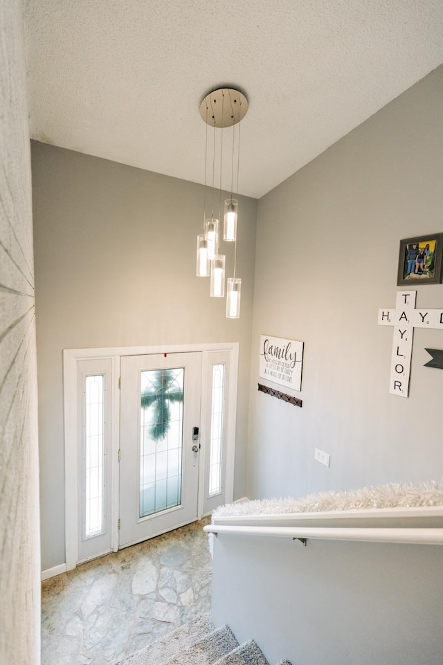 foyer featuring a textured ceiling