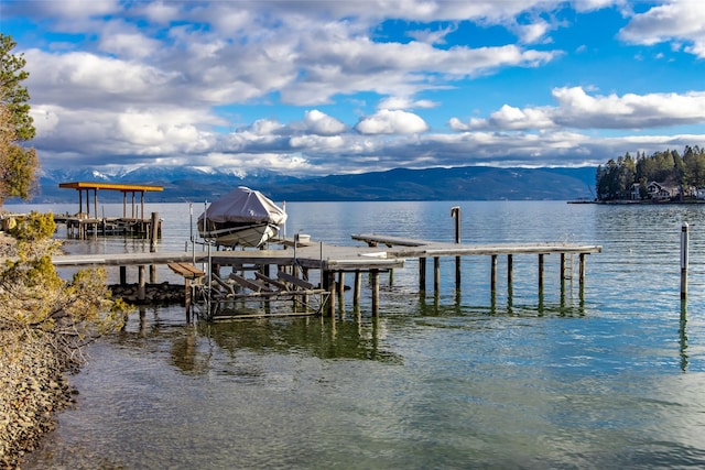 dock area featuring a water and mountain view