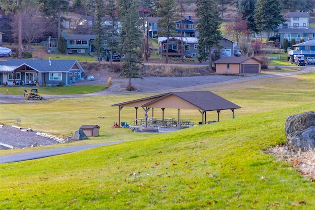 view of property's community with a gazebo and a lawn