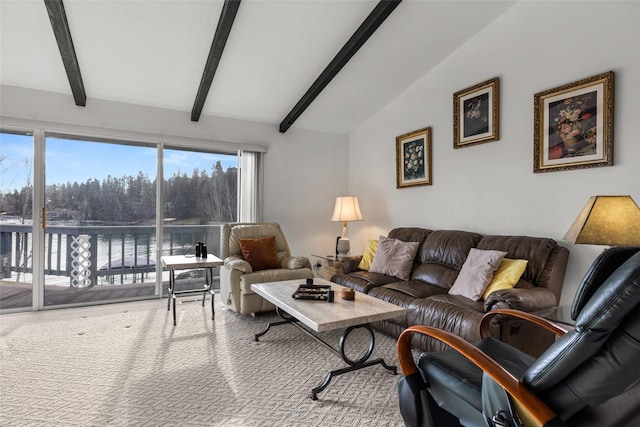 carpeted living room with vaulted ceiling with beams and a water view