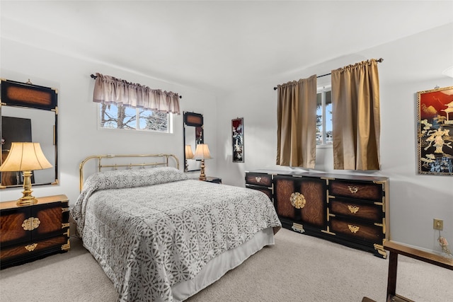 bedroom with light colored carpet