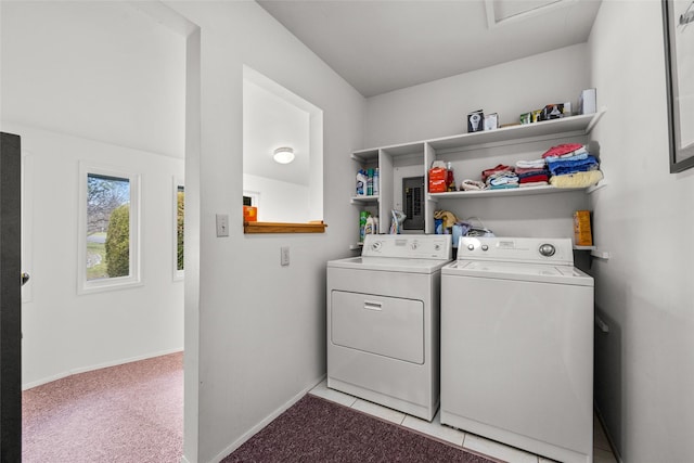 clothes washing area with separate washer and dryer and light colored carpet