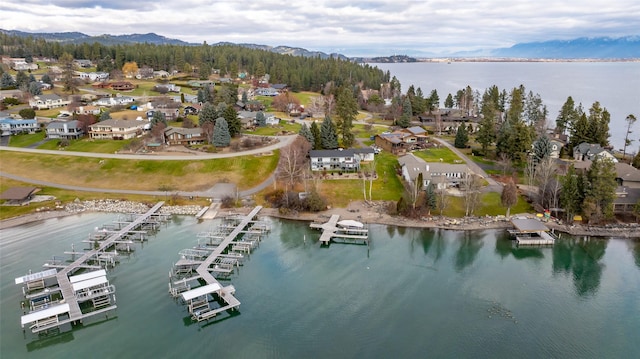 bird's eye view with a water and mountain view