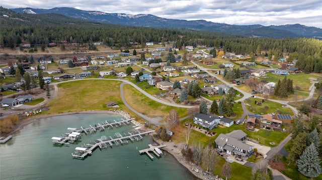 aerial view featuring a water and mountain view