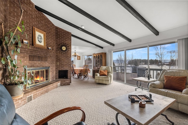 carpeted living room featuring a fireplace, beam ceiling, and brick wall