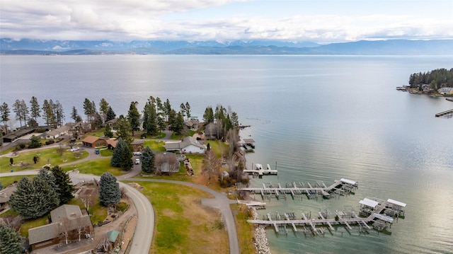 drone / aerial view with a water and mountain view