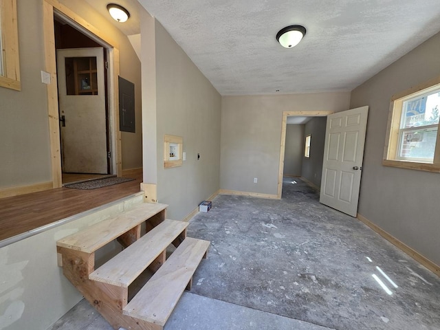 1733 S 11th St W, Missoula, MT 59801 - interior space featuring a textured ceiling, electric panel, and baseboards