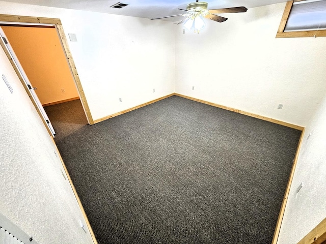 carpeted empty room with ceiling fan