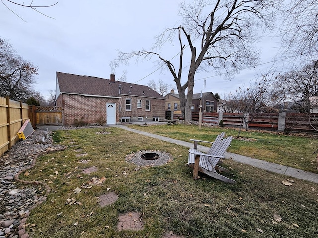 view of yard with an outdoor fire pit