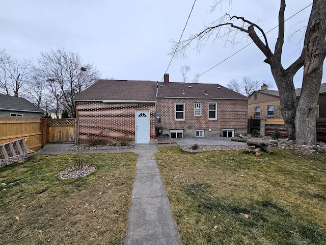 1733 S 11th St W, Missoula, MT 59801 - rear view of house featuring a patio, brick siding, a chimney, and a shingled roof