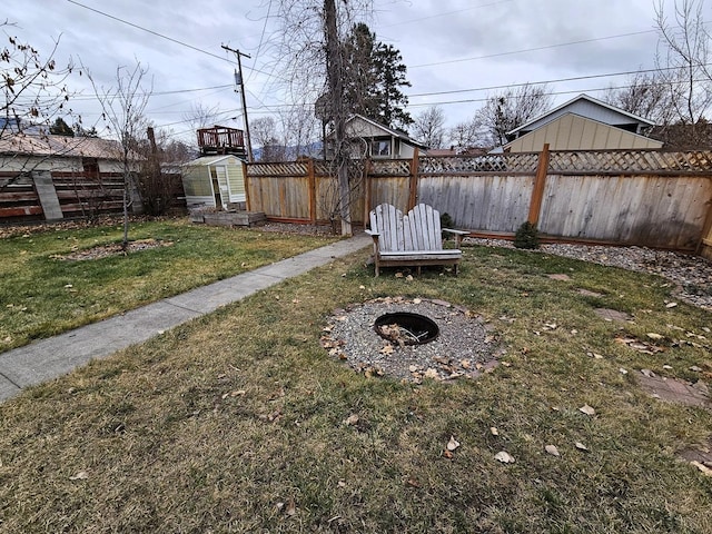 1733 S 11th St W, Missoula, MT 59801 - view of yard with a fire pit and an outbuilding