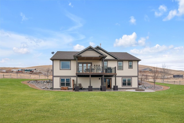 rear view of property with a lawn and an outdoor hangout area