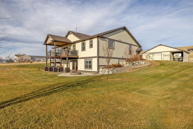 rear view of house featuring a yard and a patio area