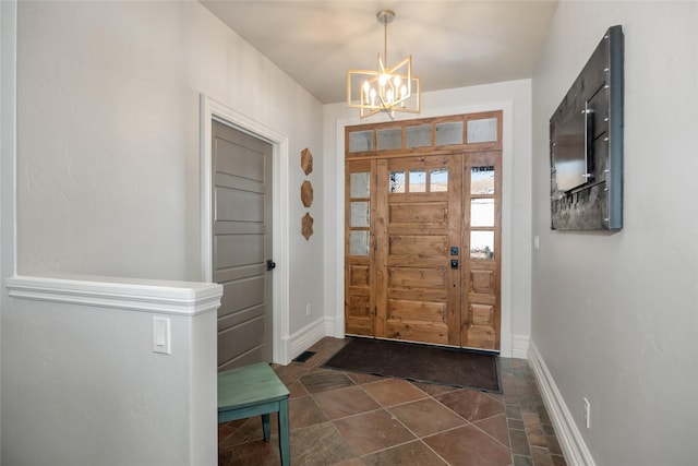 entryway with a notable chandelier