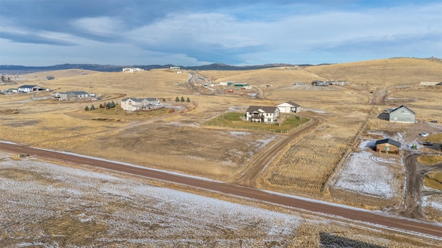 drone / aerial view featuring a mountain view and a rural view