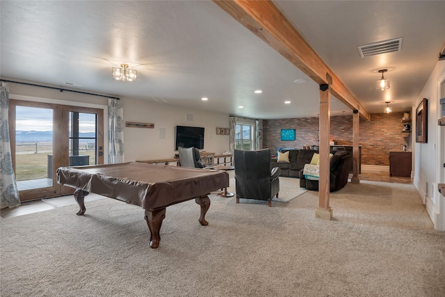 recreation room with french doors, brick wall, light colored carpet, beam ceiling, and pool table