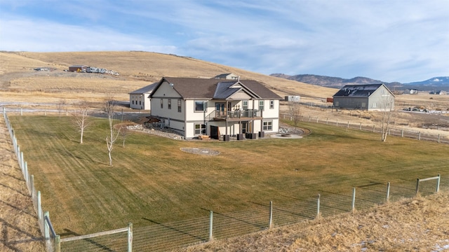 drone / aerial view with a mountain view and a rural view