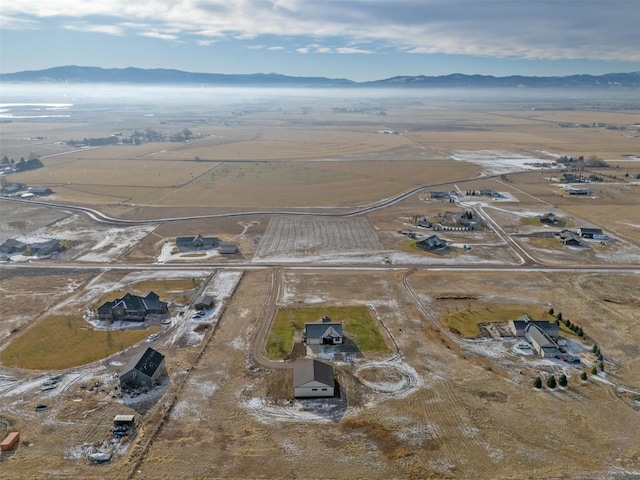 drone / aerial view with a mountain view and a rural view