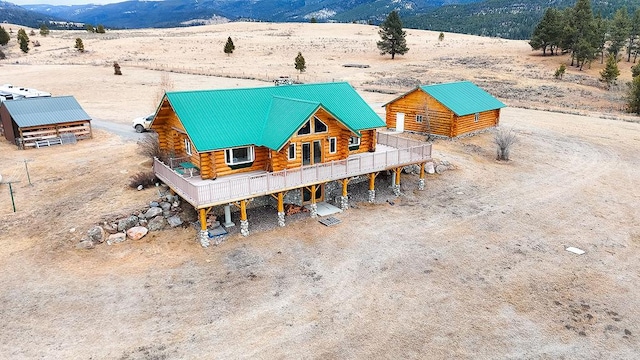 birds eye view of property featuring a mountain view