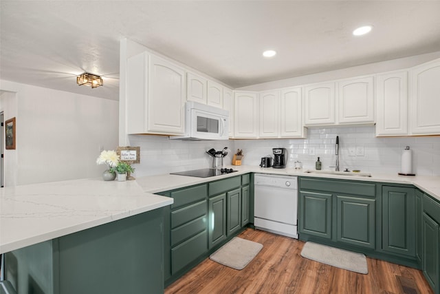 kitchen featuring white cabinets, light wood-type flooring, white appliances, and sink