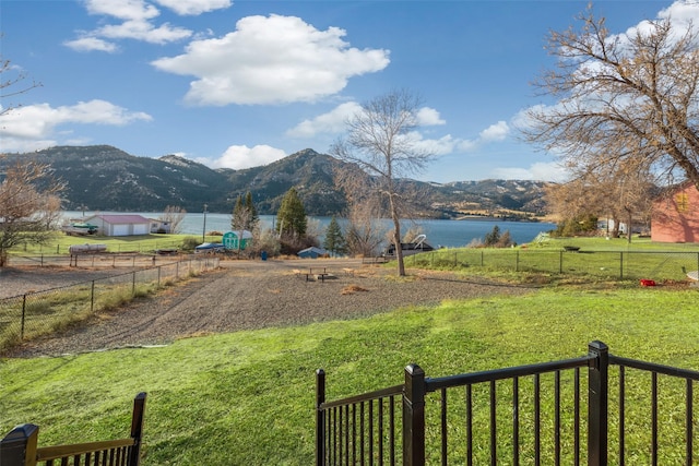 view of yard featuring a water and mountain view