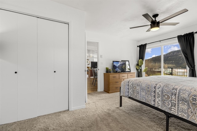 bedroom featuring access to outside, ceiling fan, and light colored carpet