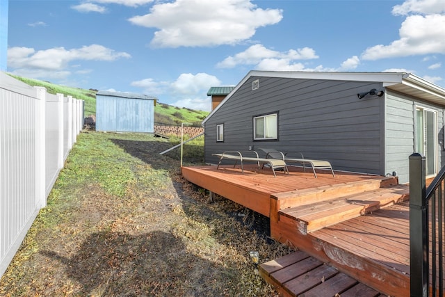 wooden deck with a shed