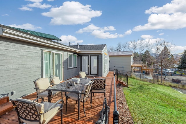 wooden deck with a yard