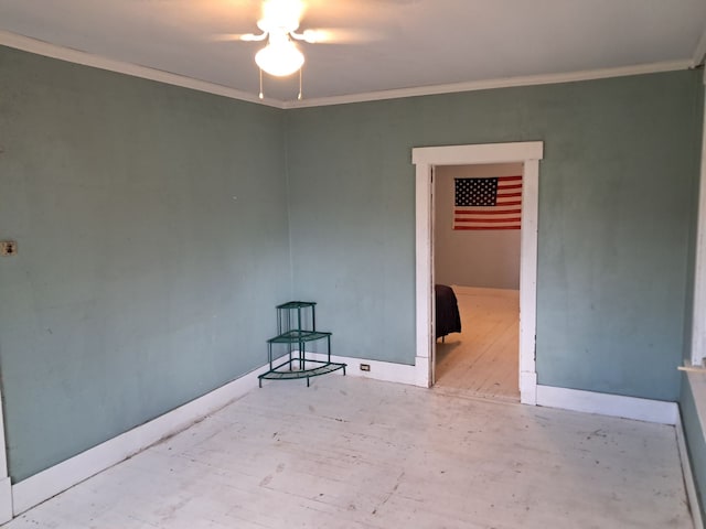 spare room with light hardwood / wood-style flooring, ceiling fan, and crown molding