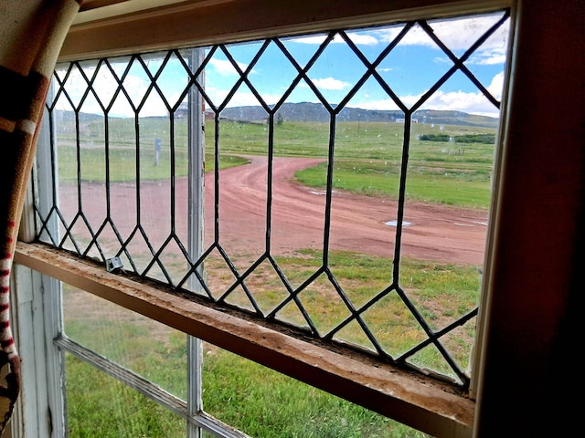 exterior details featuring a mountain view and a rural view