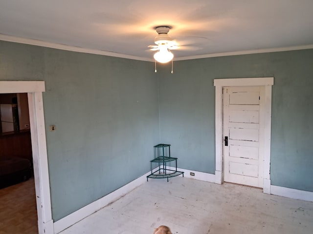 spare room featuring crown molding and ceiling fan