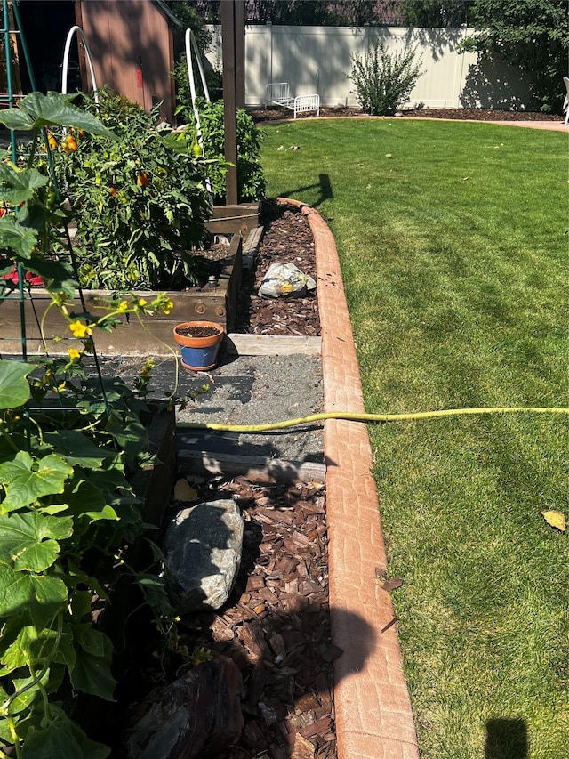 view of yard featuring a garden and fence