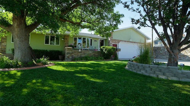 single story home featuring a garage, driveway, stone siding, and a front yard