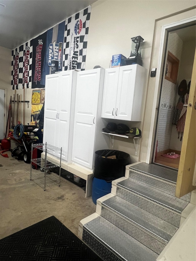 mudroom with concrete flooring