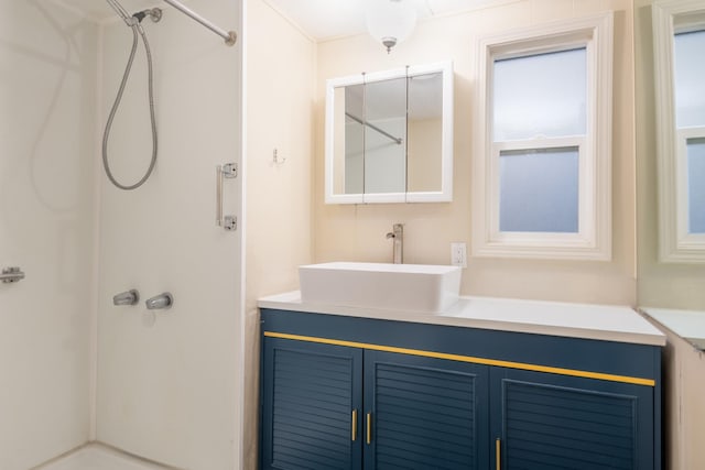 bathroom with a shower and vanity